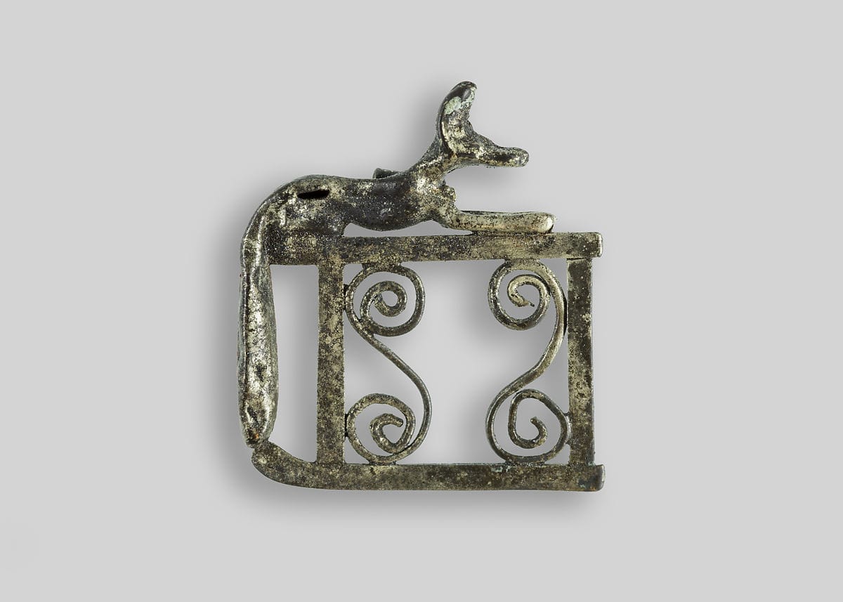 An ancient Egyptian silver amulet of Anubis on his shrine