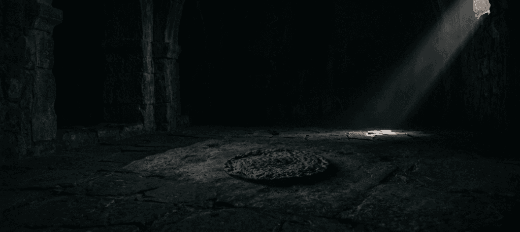 Unleavened bread resting in a dark rock tomb