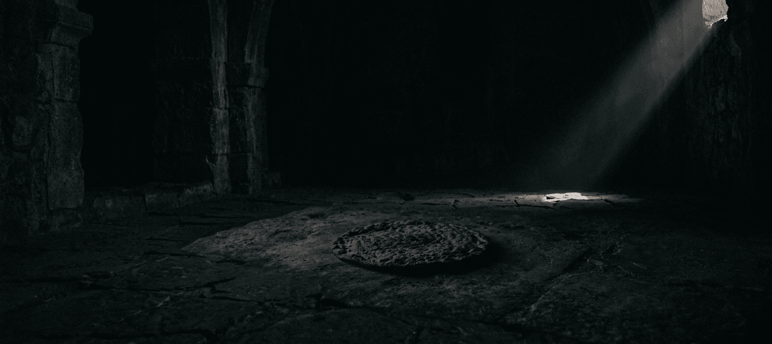 Unleavened bread resting in a dark rock tomb