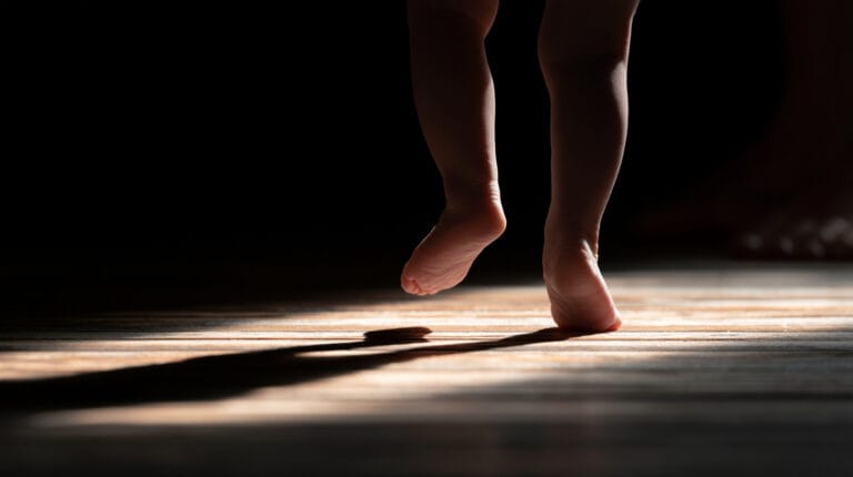 A baby's first wobbling steps across the floor